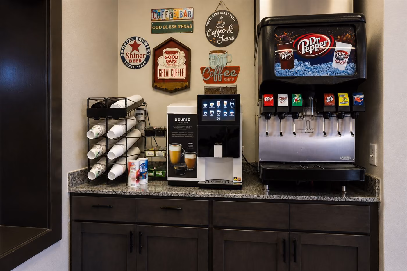 Complimentary coffee bar with a Keurig and soda fountain